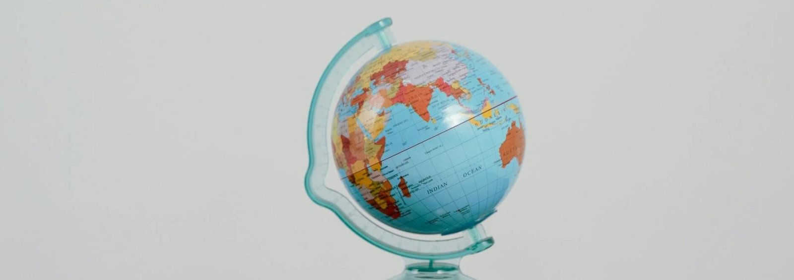globe beside a passport